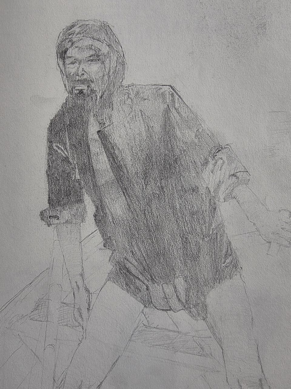 Graphite sketch of a hooded bearded man in a dark jacket